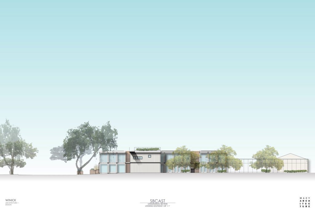 Architectural drawing of cluster of building containing larger space, fence and several trees.