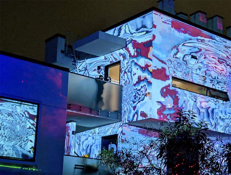 Abstract design projected on the front of buildings at SBCAST.
