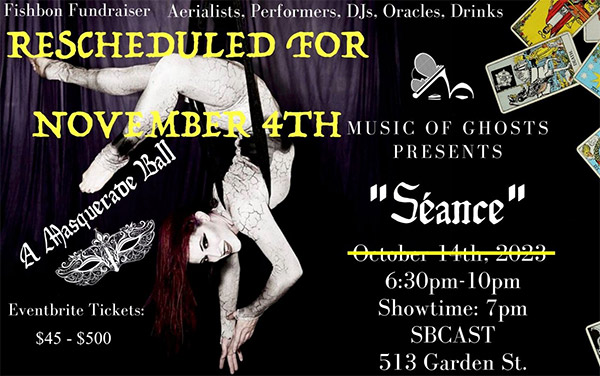 Woman Aerialist suspended from silks.