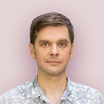 Young lightly pigmented man with brown hair, staring intently.